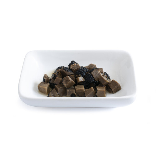 Trufo – Black Summer Truffle Cubes (5x5x5 mm) neatly arranged on a white rectangular dish, showcasing uniformly diced truffle pieces with a rich, dark texture